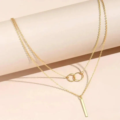 Collier rétro en or avec pendentif rond double