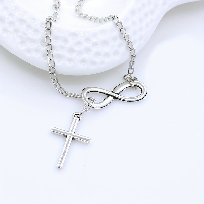 Pendentif croix éternelle en or blanc